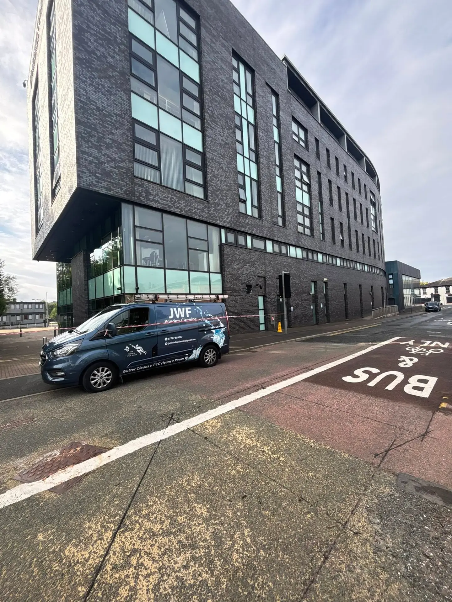 JWF Window Cleaning carrying out high-reach external cleaning at Blackburn College