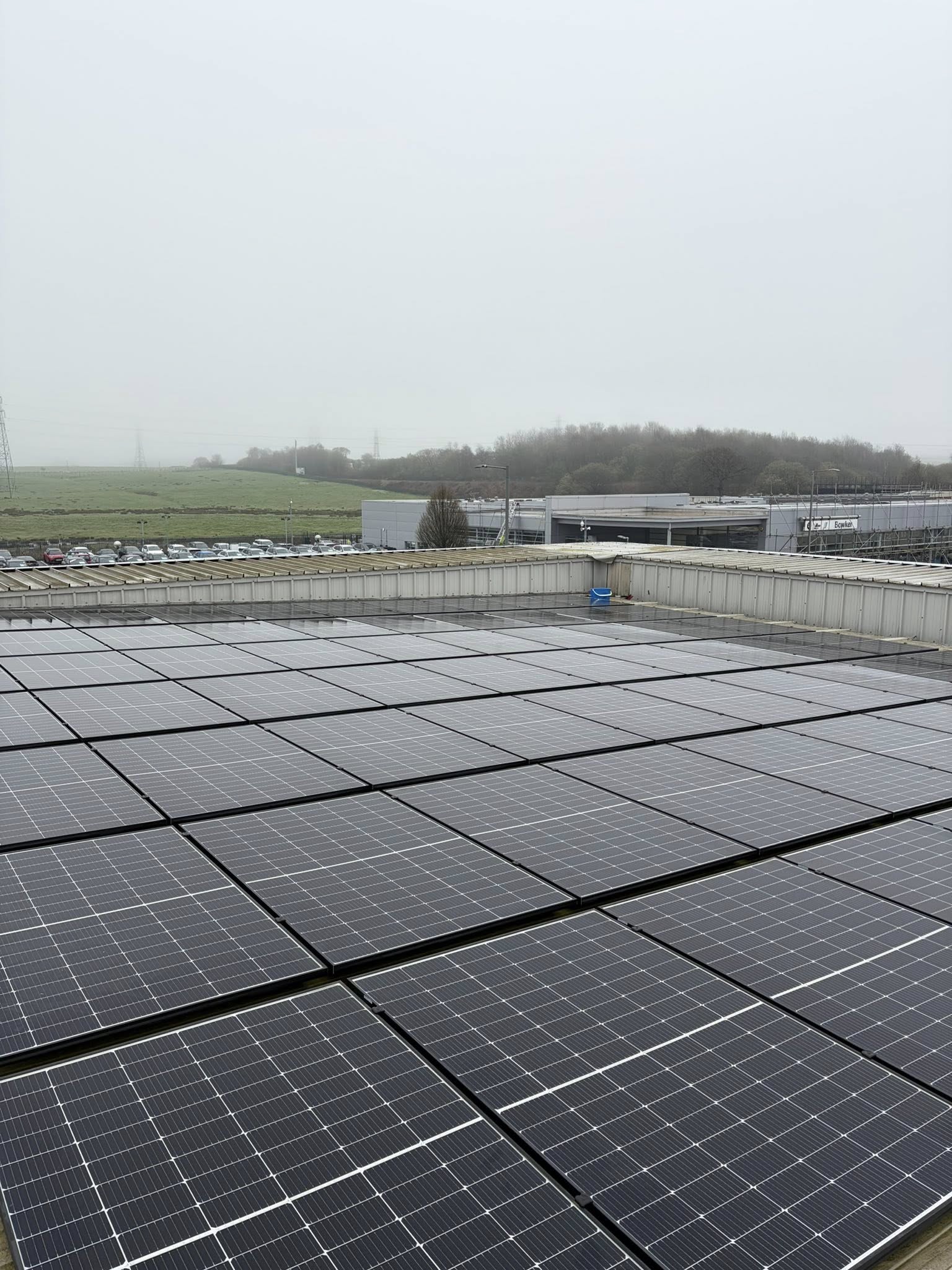 JWF cleaning solar panels with a pure water reach pole from the ground